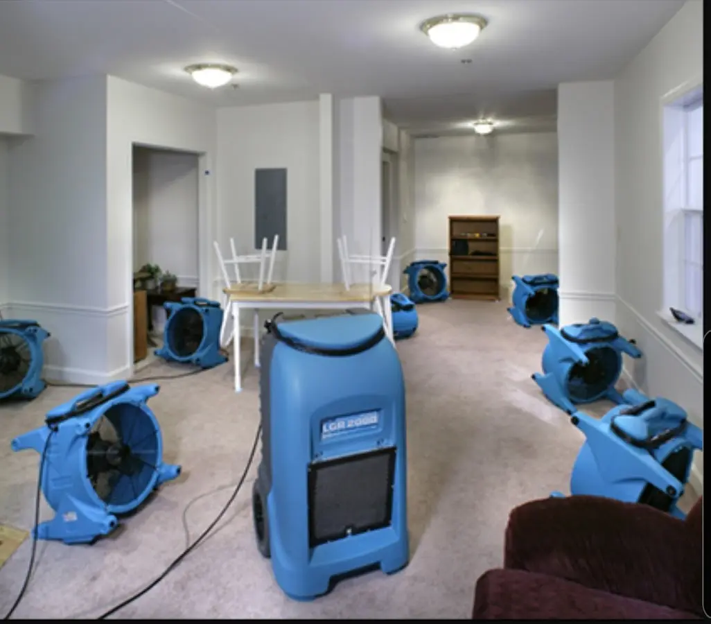 Air movers and dehumidifier setup for Water Extraction & Removal in Paola